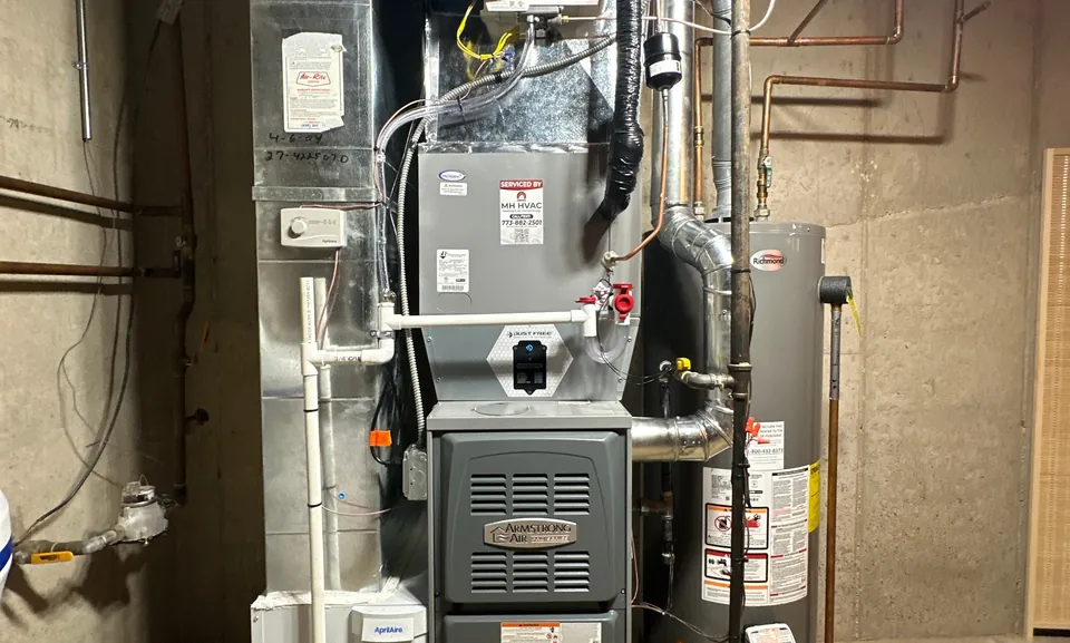 Armstrong Air gas furnace installed in a basement utility room