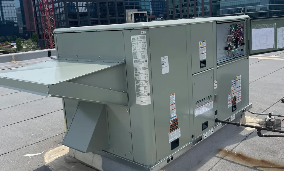 Packaged rooftop HVAC unit with the Chicago skyline behind it