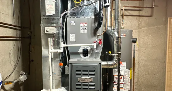 Armstrong Air gas furnace installed in a basement utility room
