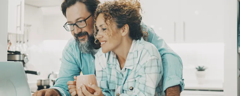 Homeowners reviewing HVAC financing options at their kitchen table